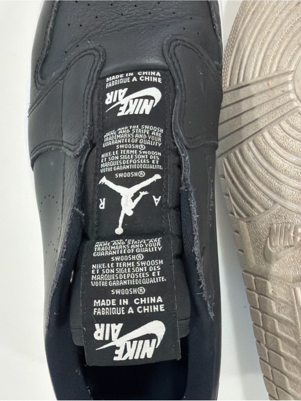 Nike Black Leather Low-Top Sneaker with White Tongue Logos
